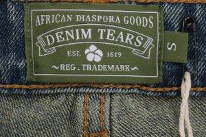 Denim Tears logo tag
