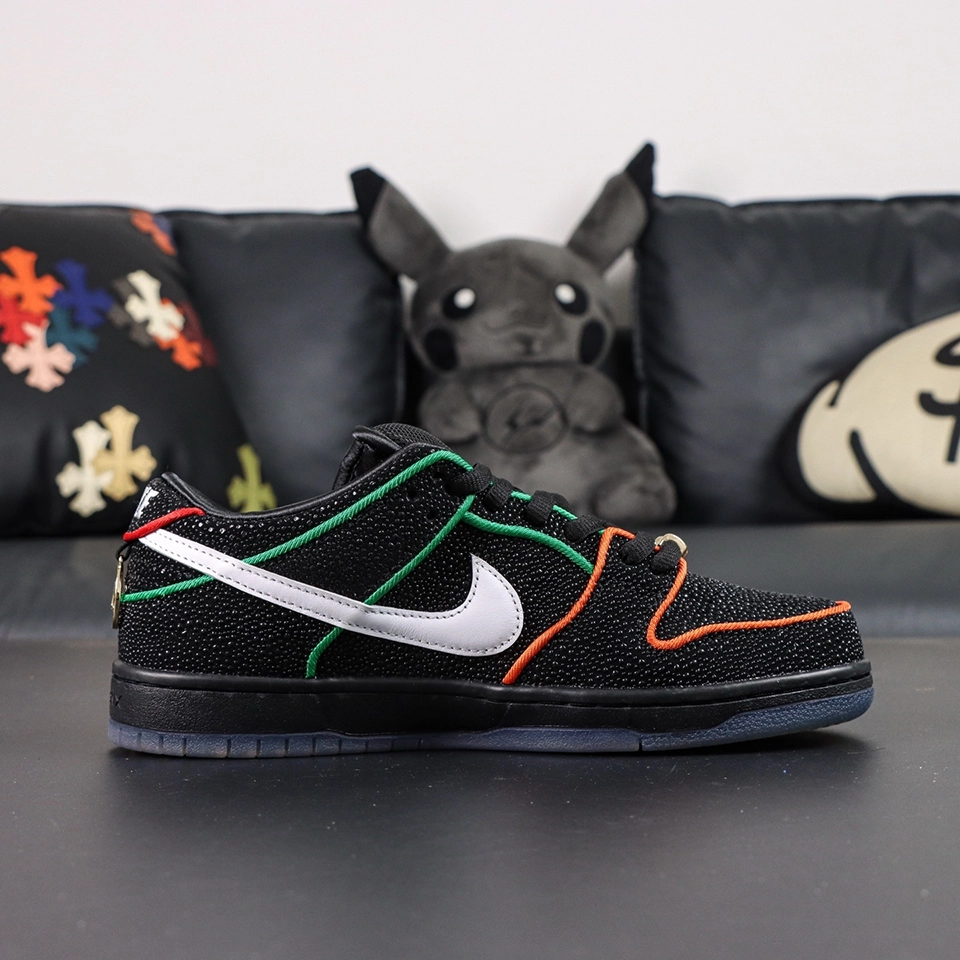 Lateral side view of Bronx Girls Skate x Nike Dunk Low SB ‘Mel & Kava’ highlighting multicolor piping and white Swoosh