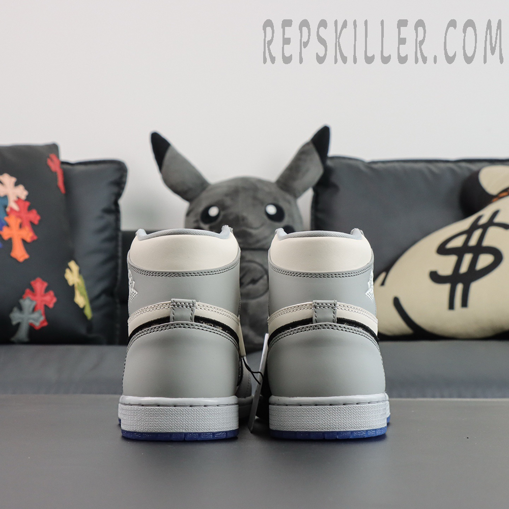 Rear heel view of Dior x Air Jordan 1 High featuring embroidered Air Dior Wings logo.