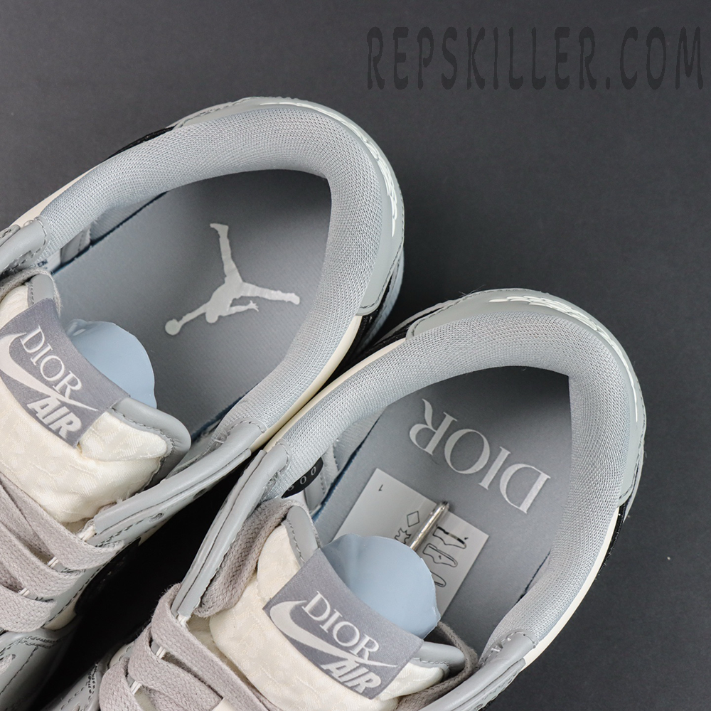 Dior x Air Jordan 1 Low sneakers top view showcasing Dior Air tongue tag and Jumpman logo insoles