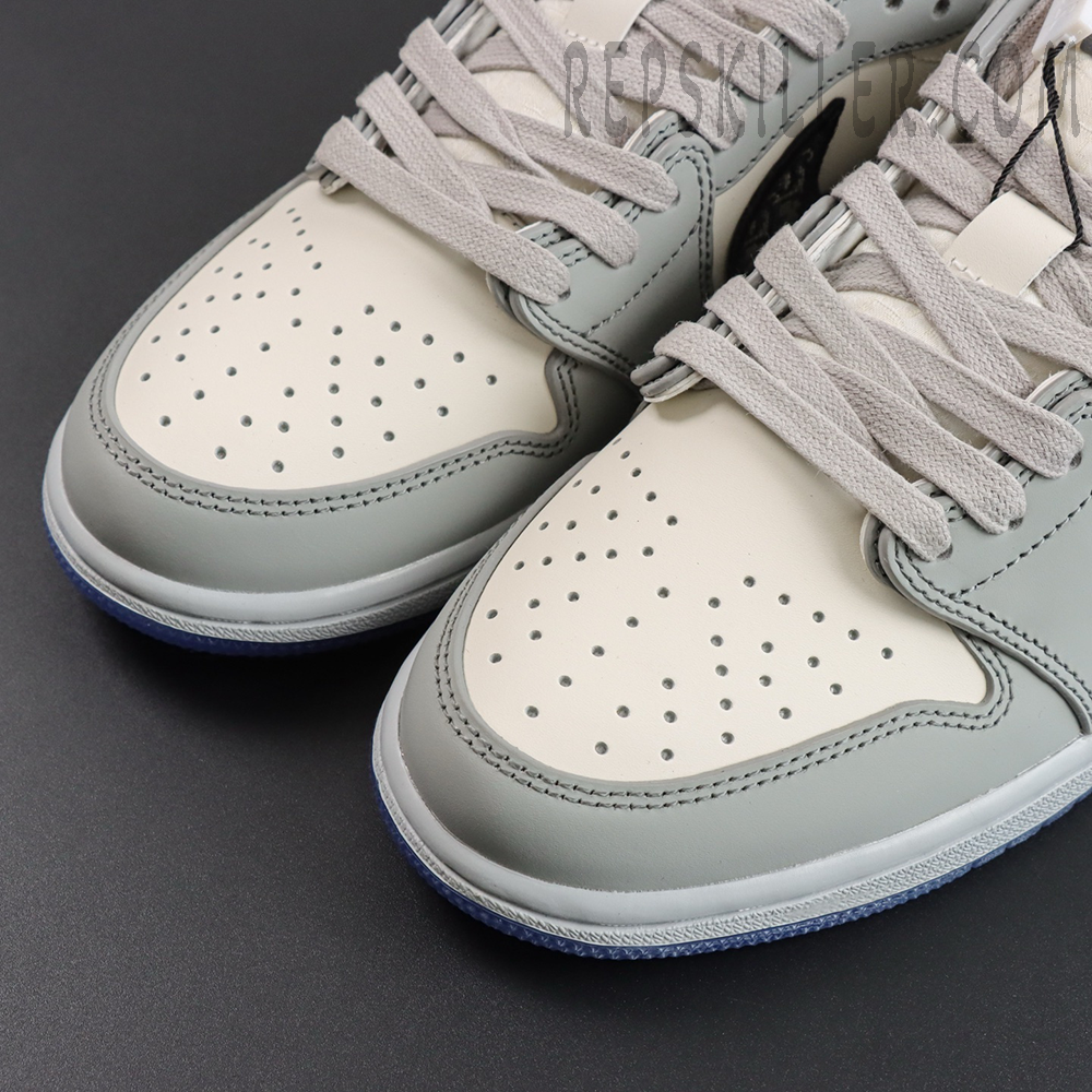 Dior x Air Jordan 1 Low close-up of perforated leather toe box and flat grey laces