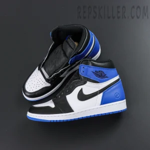 Top-down angled view of Fragment Design x Air Jordan 1 Retro High OG pair in black, white, and royal blue
