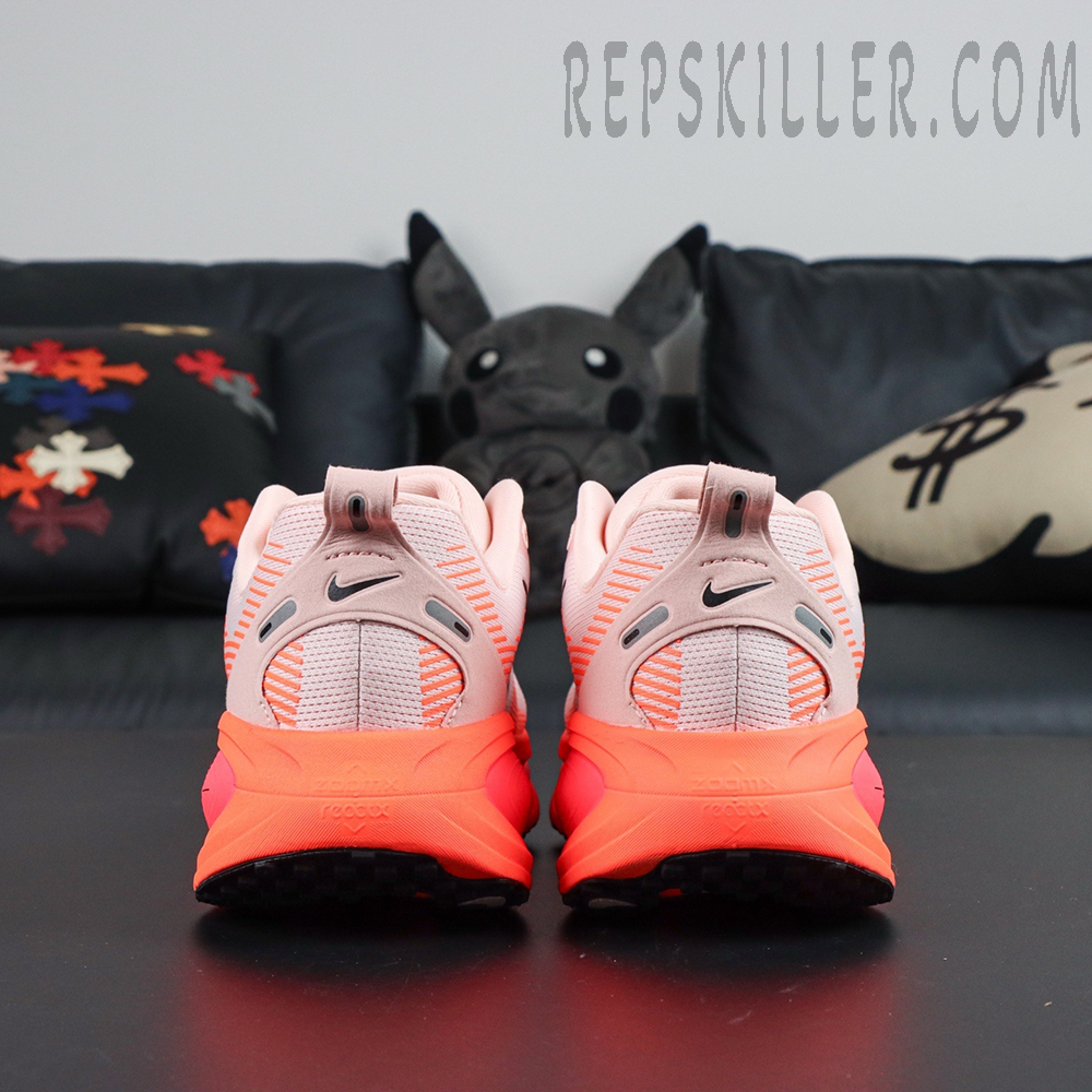 Nike Vomero 18 'Atmosphere Pink' back view highlighting pull tab and heel logo