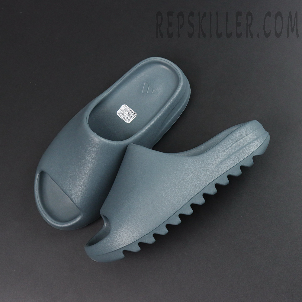 Top-down flat lay of the Yeezy Slides ‘Slate Marine’ showing the footbed and outsole.