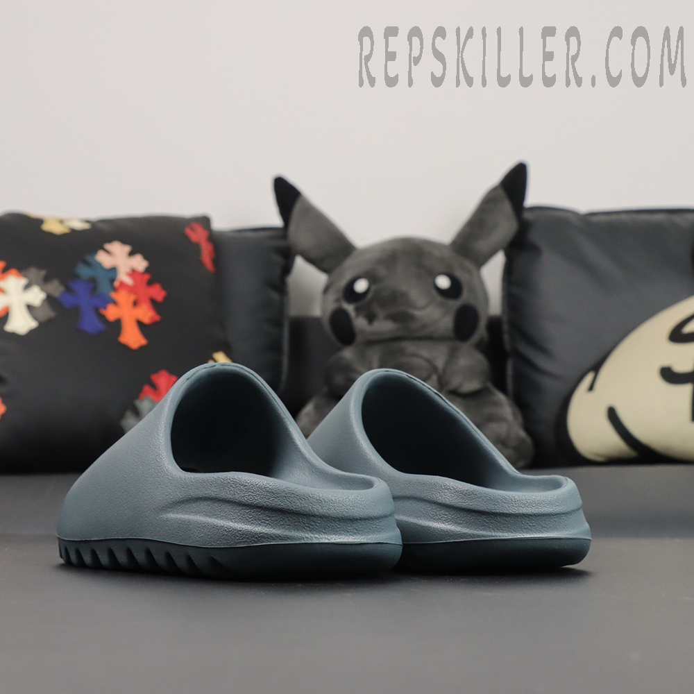 Back heel view of the Yeezy Slides ‘Slate Marine’ revealing the smooth rear profile.