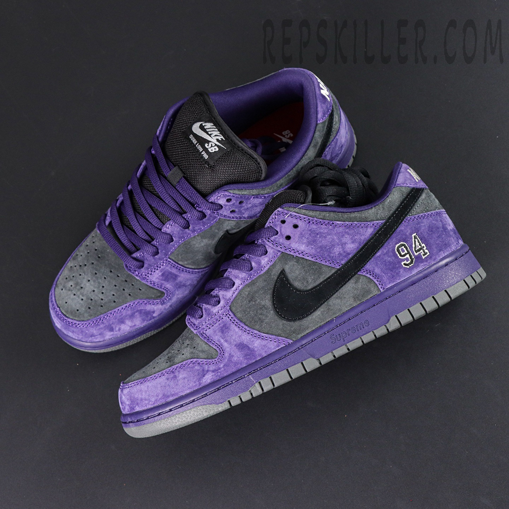 Nike Supreme x Dunk Low SB “Ink” angled top view showing premium suede material and Supreme logo detail on midsole.