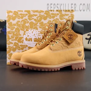 A Bathing Ape x Undefeated x Timberland 6 Inch “Wheat” side view showing wheat nubuck upper, embossed camo detail, and branded leather tag.