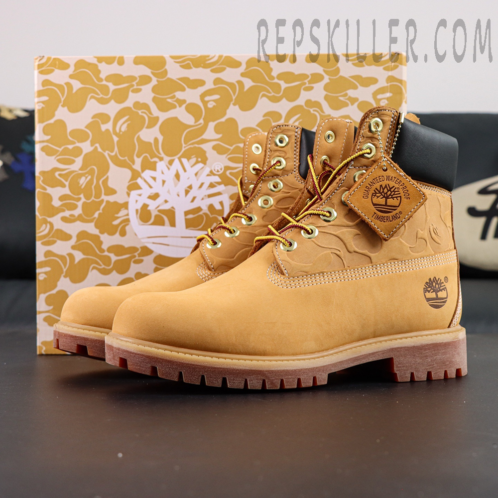 A Bathing Ape x Undefeated x Timberland 6 Inch “Wheat” side view showing wheat nubuck upper, embossed camo detail, and branded leather tag.