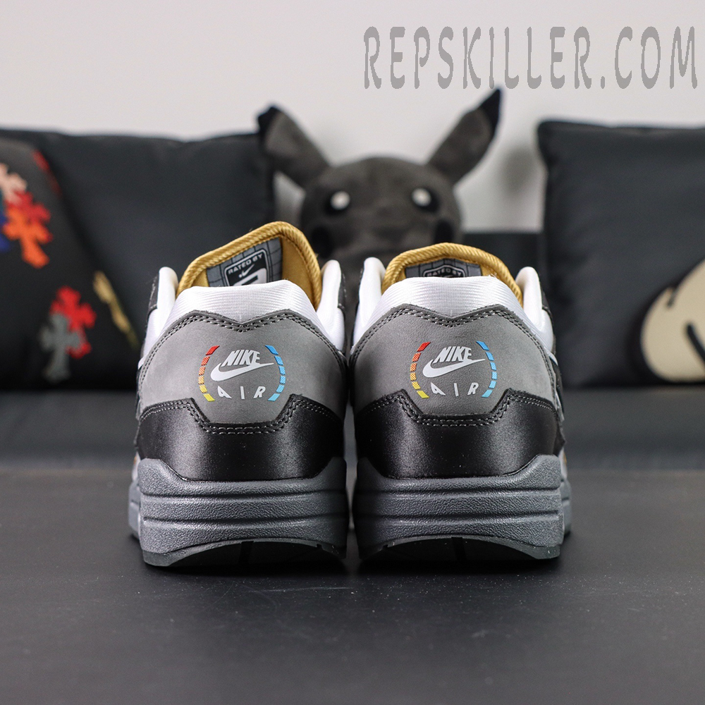 Rear view of Nike Air Max 1 “Low Poly - Big Head Mode” featuring multicolor NIKE AIR heel logo and gradient detailing.