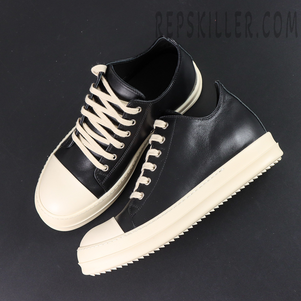 Top-down view of Hollywood Low “Black Milk” showing black and cream contrast design and flat laces.
