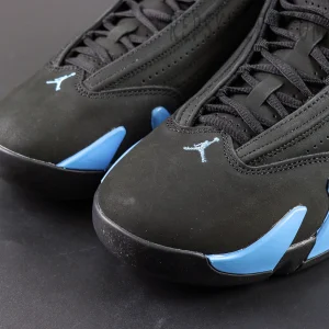 Close-up of Air Jordan 14 “Black University Blue” toe area featuring embroidered blue Jumpman logo.