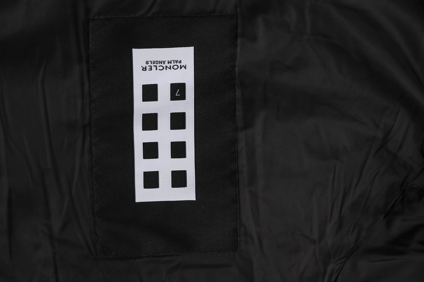 Mxxcler x Pharrell Williams Patchwork Utility Hooded Down Jacket Wash label