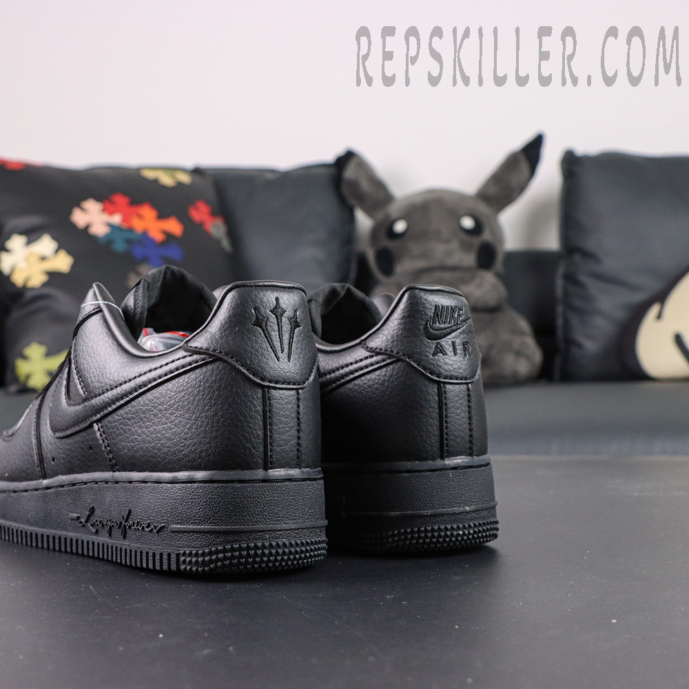 Angled rear view of NOCTA x Nike Air Force 1 “Certified Lover Boy” showing white leather construction and dual heel logos.
