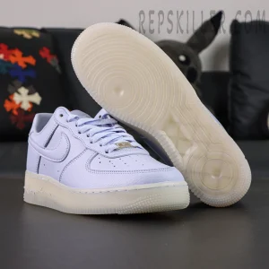 Outsole and side view of NOCTA x Air Force 1 “Palest Purple” showing translucent sole and circular traction pattern.