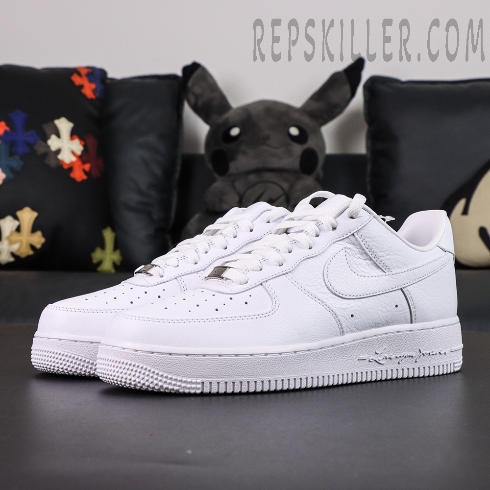 Side angle of NOCTA x Air Force 1 “Certified Lover Boy” showing clean leather upper and signature sole text “Love You Forever.”