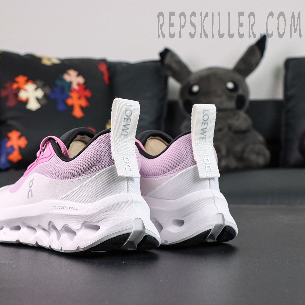 Rear angled view of ON L × Cloudtilt 2 “Pink White” highlighting sculpted heel design and pull tabs.