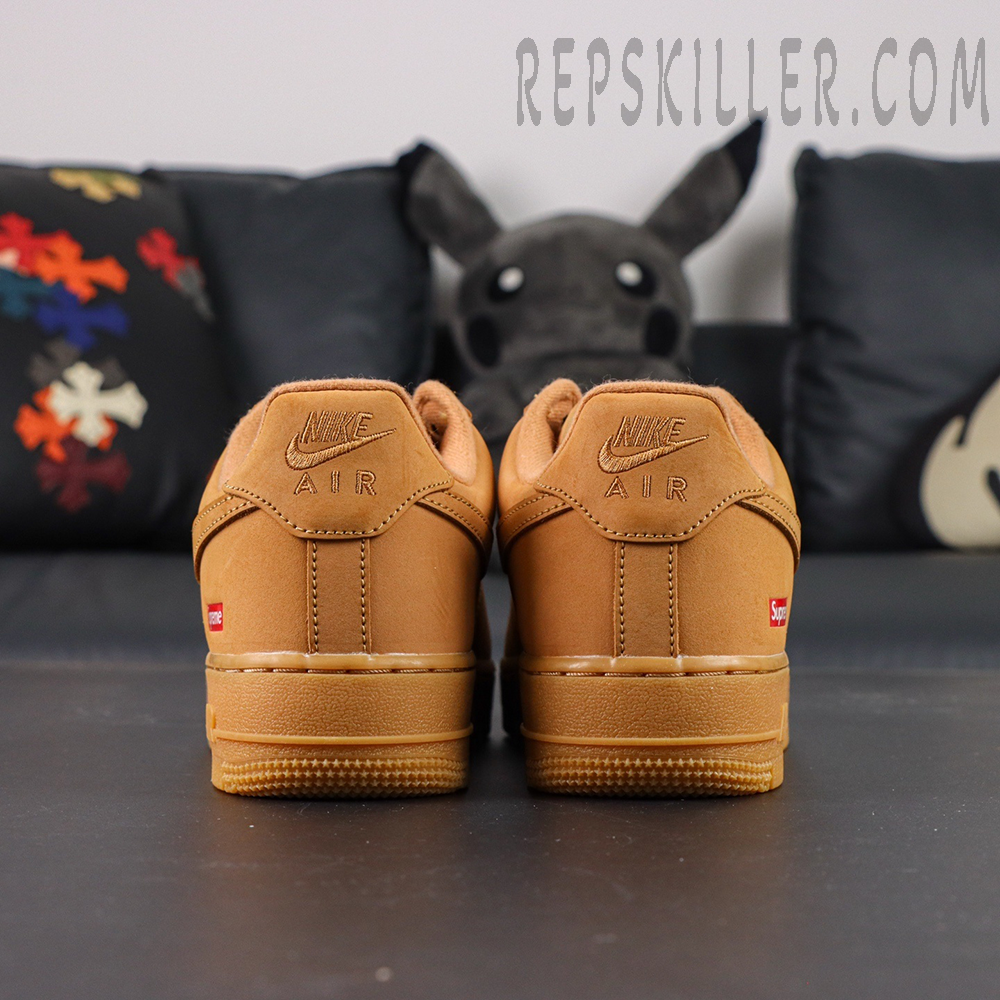 Back heel view of Sup x Air Force 1 Low SP ‘Box Logo - Wheat’ emphasizing embossed Nike Air and red Supreme tag