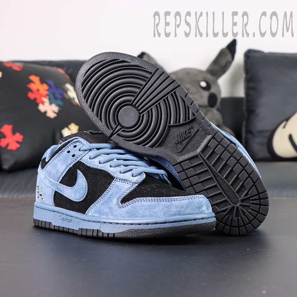 Close-up of Supreme x Nike SB Dunk Low “Ocean Fog” outsole and side profile, showing the black sole and blue suede overlays.