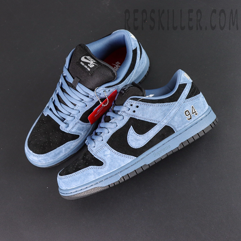 Top view of Supreme x Nike SB Dunk Low “Ocean Fog” showing both shoes and detailed laces design.