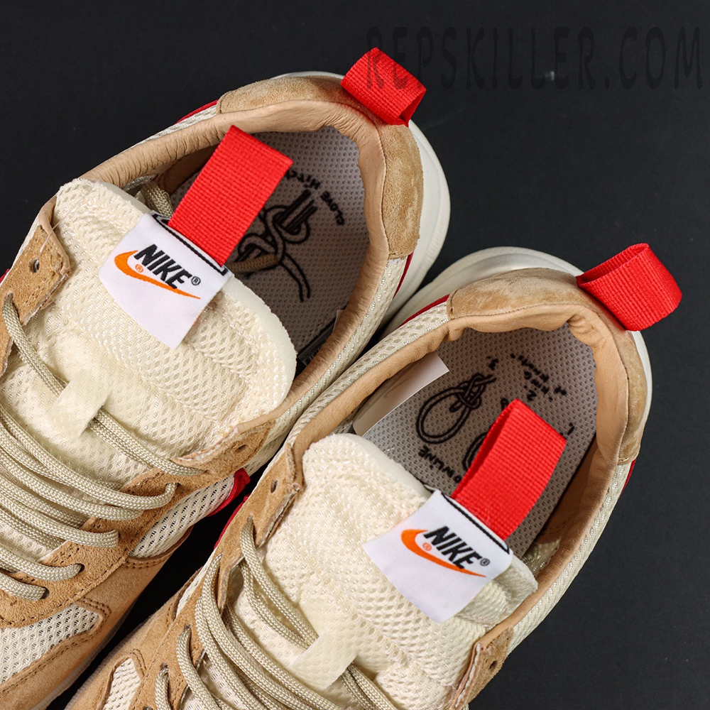 Top-down look at the Mars Yard 2.0 tongues with Nike branding and red pull tabs.