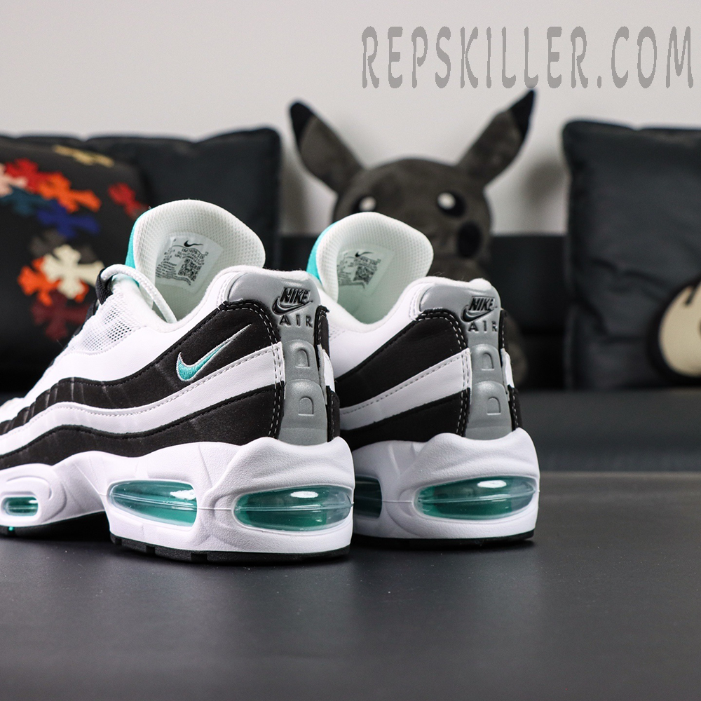 Back angle of Nike Air Max 95 OG Black Border highlighting layered suede stripes and teal mini Swoosh