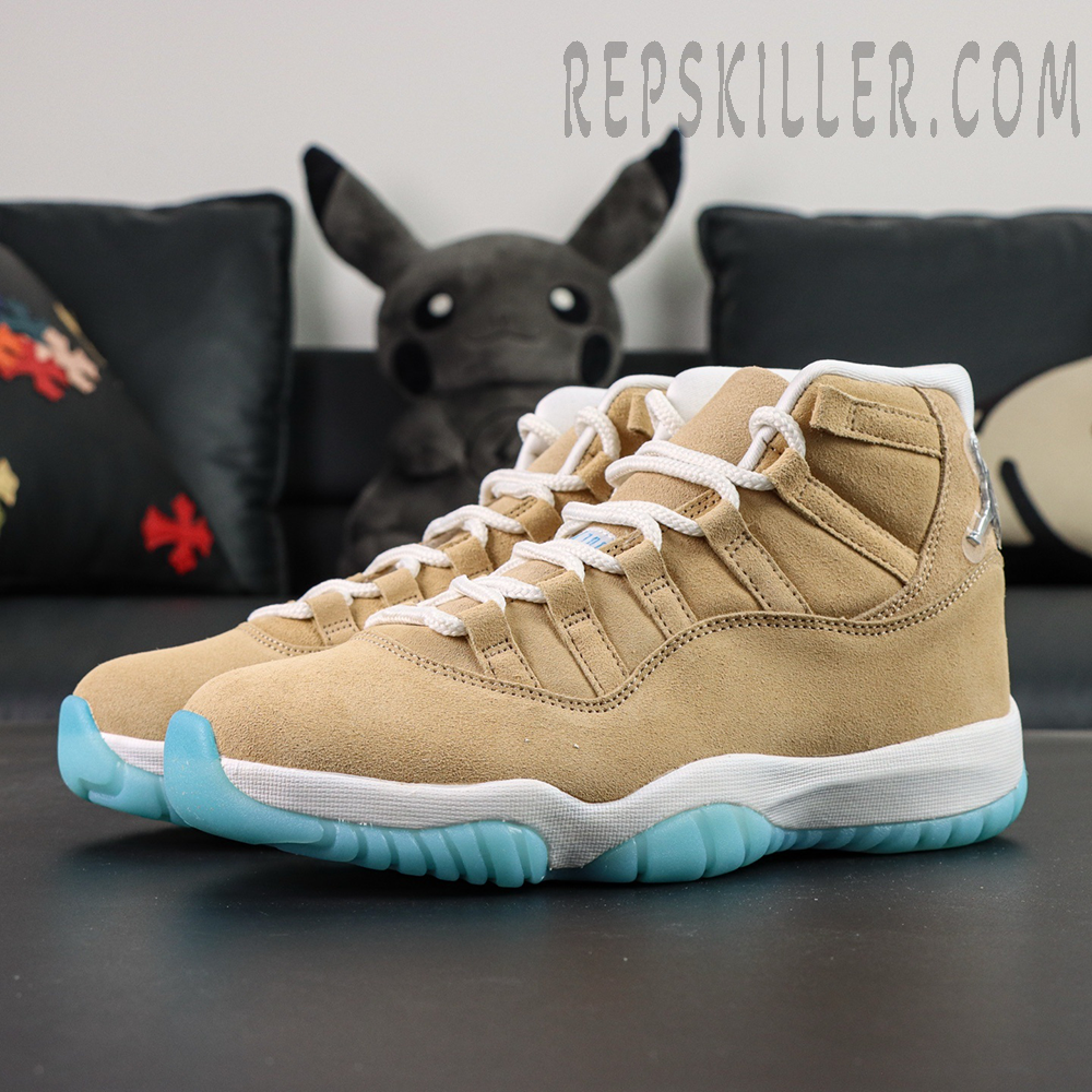 Jordan 11 Retro ‘H-Town’ sneakers in tan suede with icy blue outsole, side-angle display.