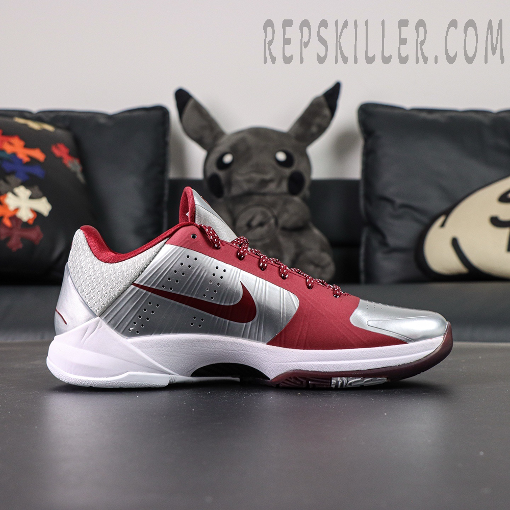 Lateral side view of Kobe 5 Protro ‘Lower Merion Aces’ featuring red Swoosh and silver upper.