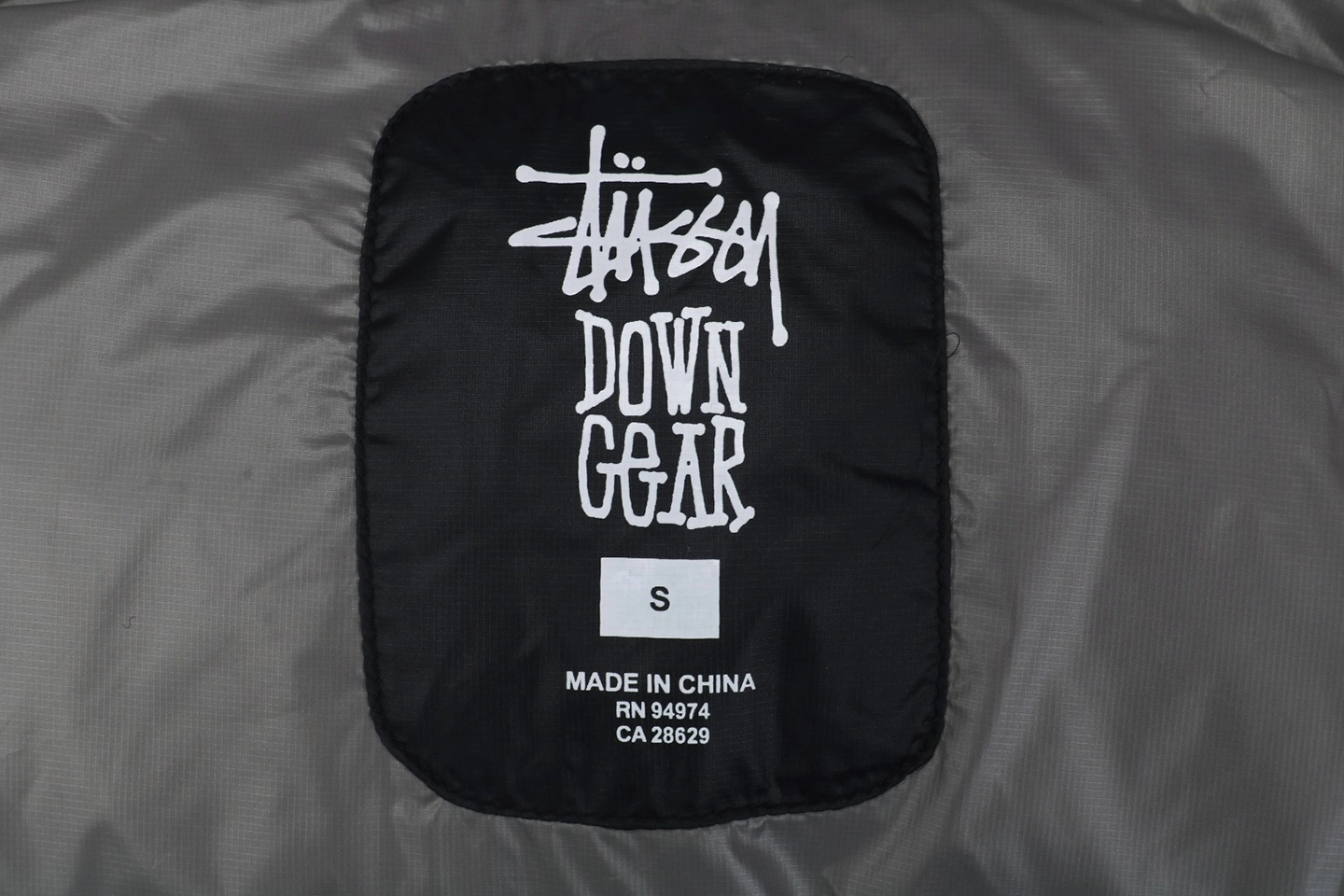 Stussy Classic Logo Hooded Down Jacket – Black/Grey Embroidery Brand label