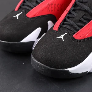 Air Jordan 14 Gym Red toe box close-up with black suede and embroidered Jumpman