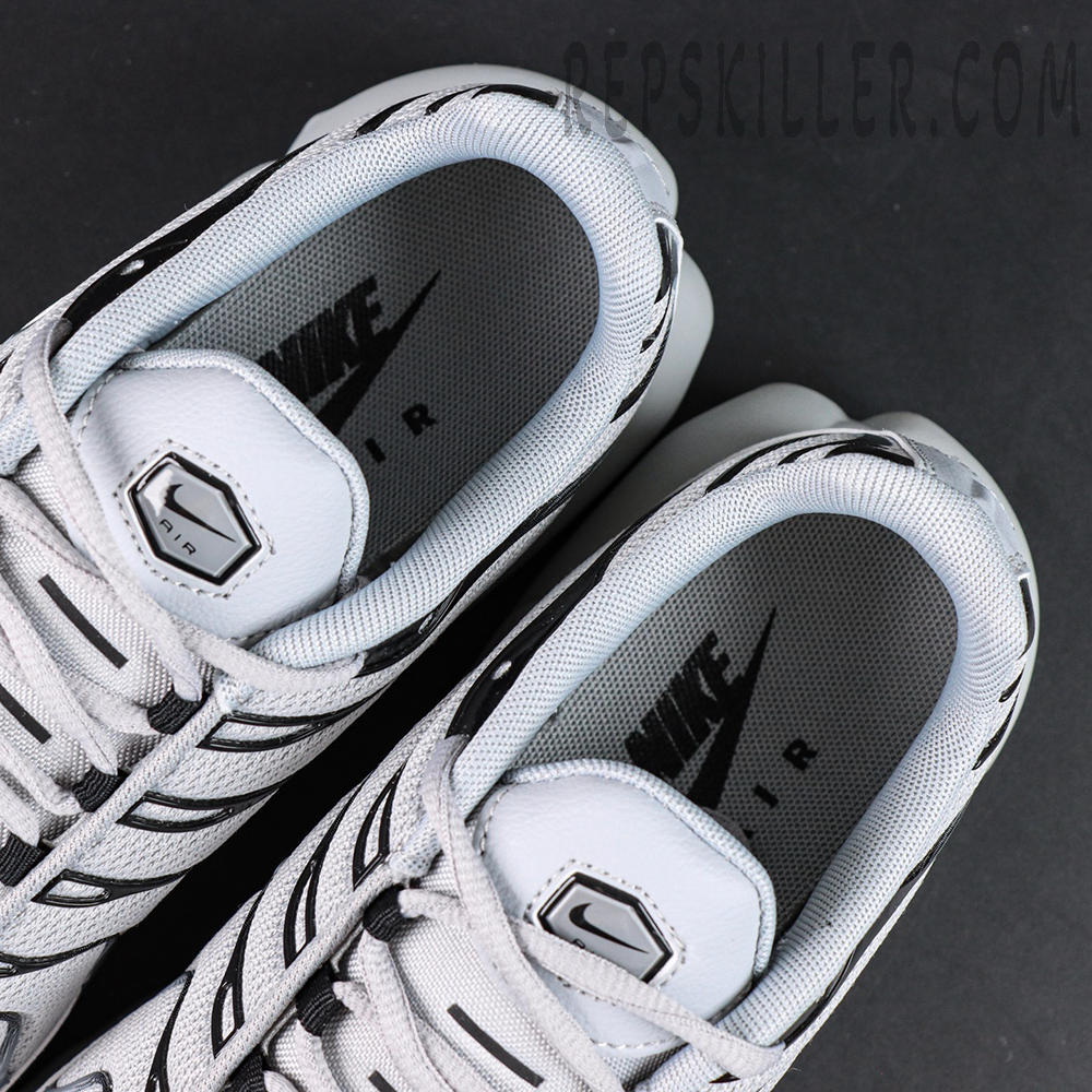 Top-down view of Nike Air Max Plus TN Wolf Grey showing insole branding and tongue Nike Air logo