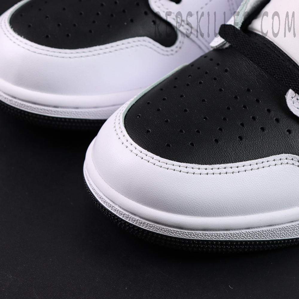 Fragment Design x Union LA x Air Jordan 1 “White Black” collaboration sneakers, toe box close-up with black perforated leather and white overlays