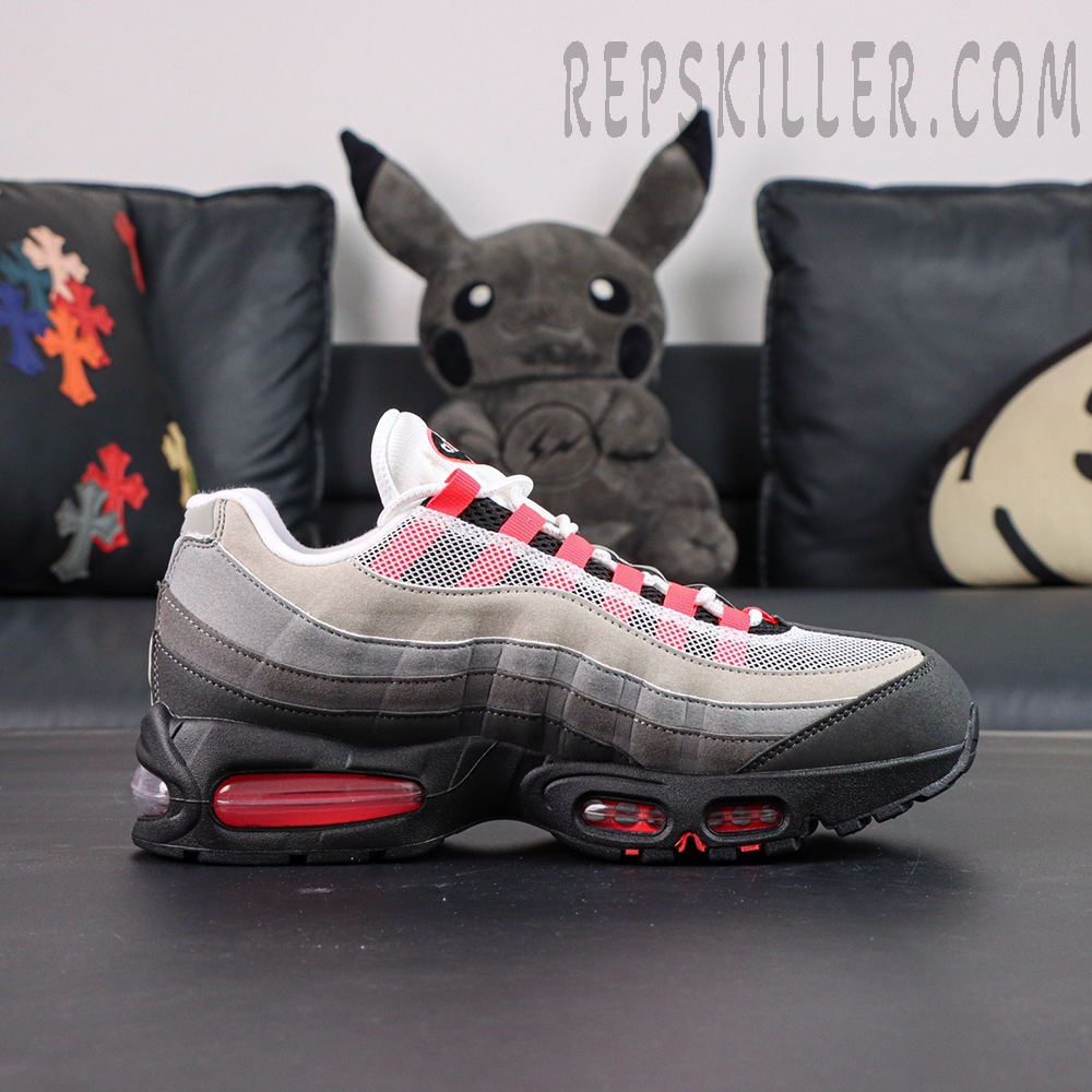 Side profile of Nike Air Max 95 Big Bubble Solar Red showing layered suede and red Air unit