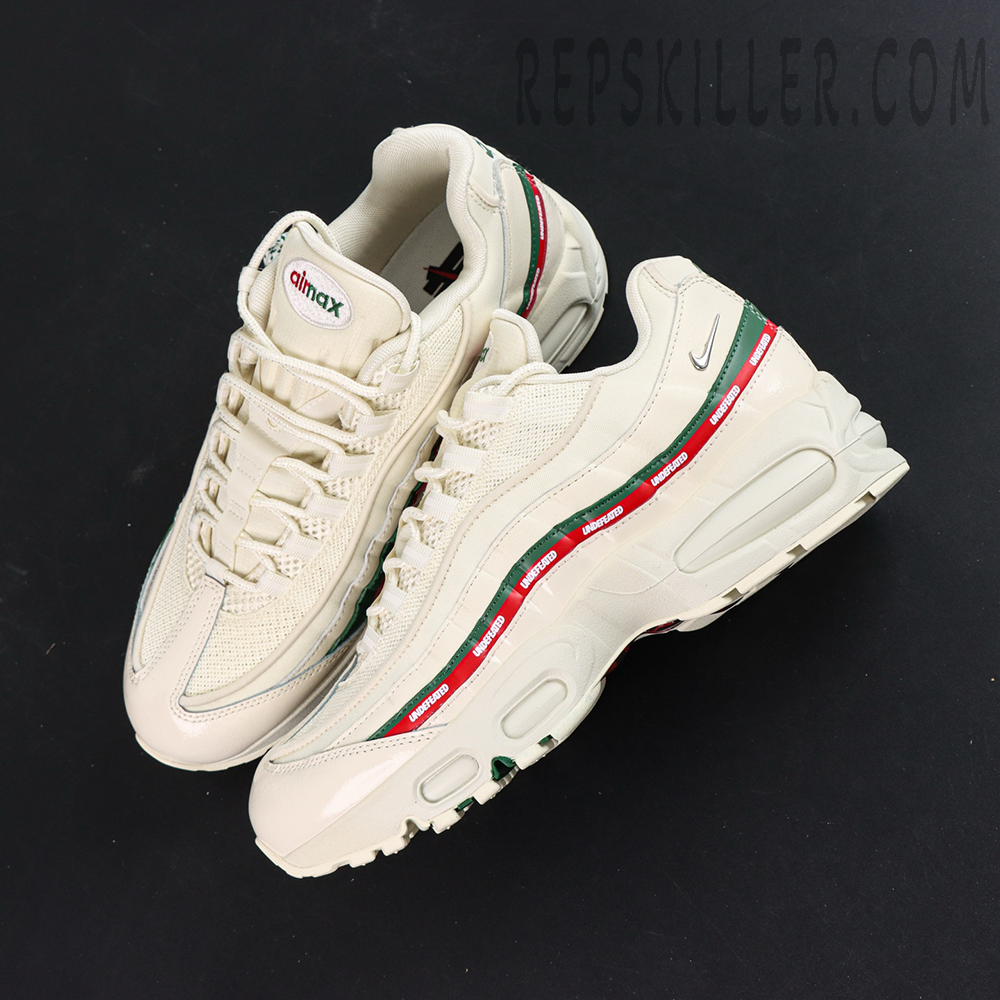 Top-down angled view of Undefeated x Nike Air Max 95 “Sail”, highlighting layered upper design