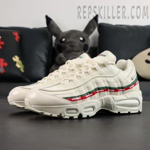 Pair on-foot style display of Undefeated x Nike Air Max 95 “Sail” from a side angle