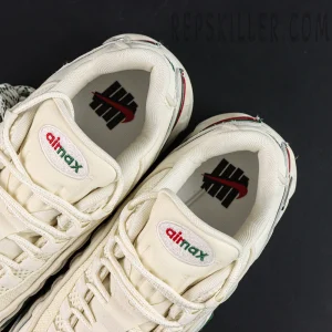 Insole and tongue detail of Undefeated x Nike Air Max 95 “Sail” showing Air Max logo