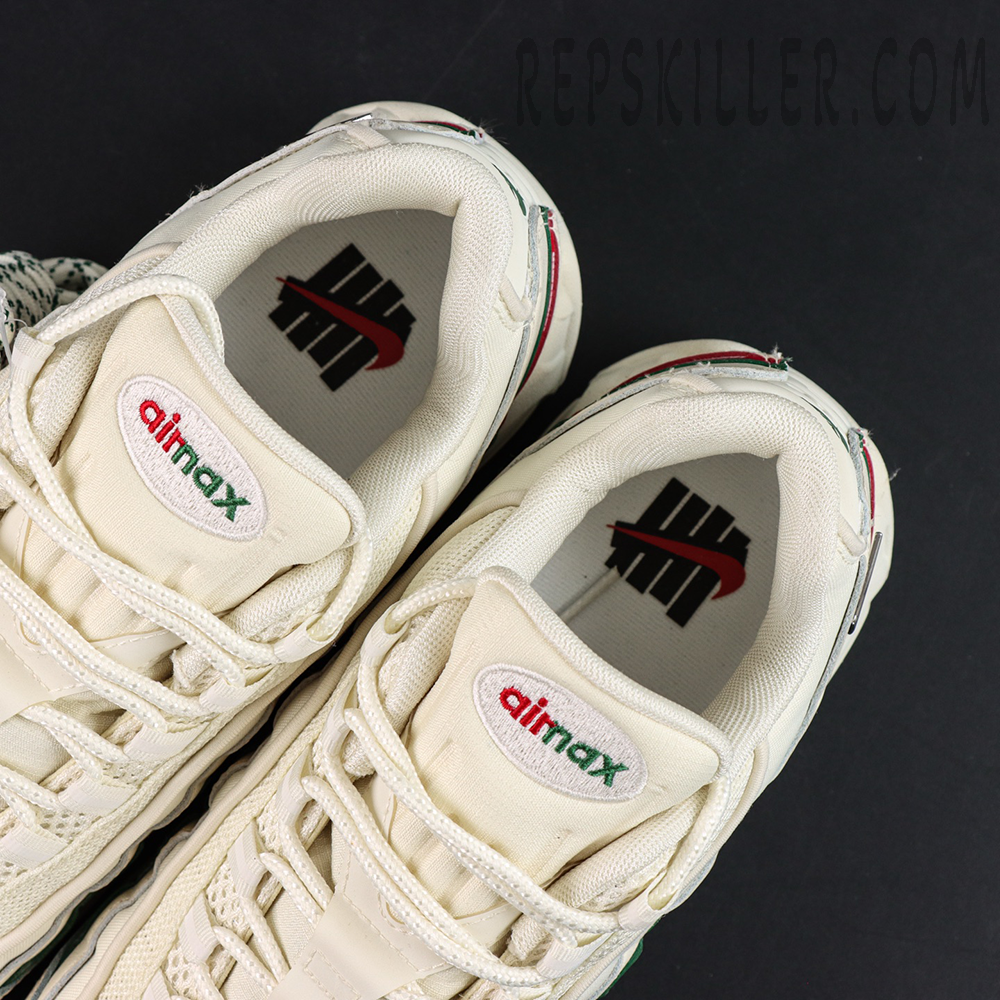 Insole and tongue detail of Undefeated x Nike Air Max 95 “Sail” showing Air Max logo