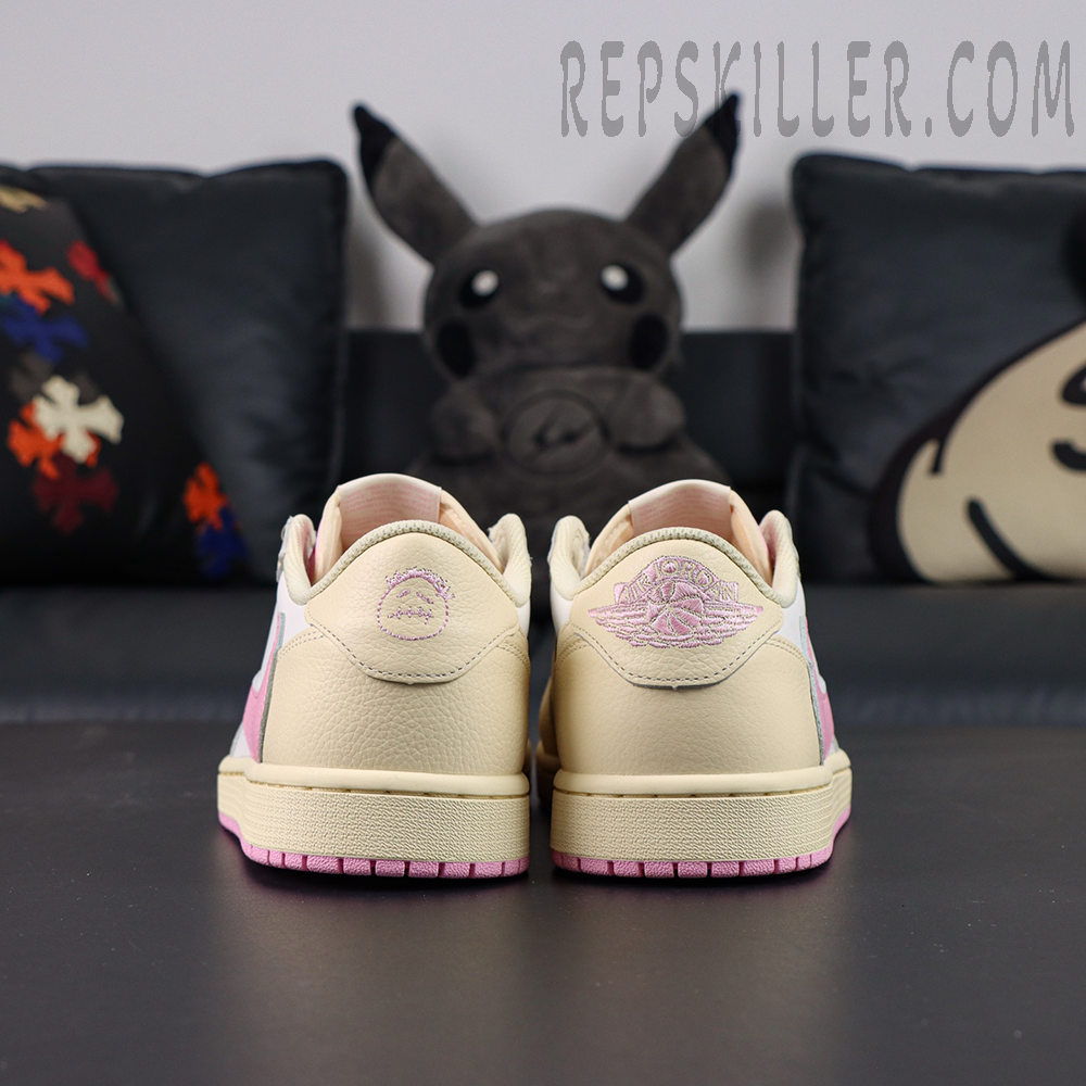 Travis Scott x Air Jordan 1 Low Muslin Pink sneakers, direct heel view with mismatched heel logos
