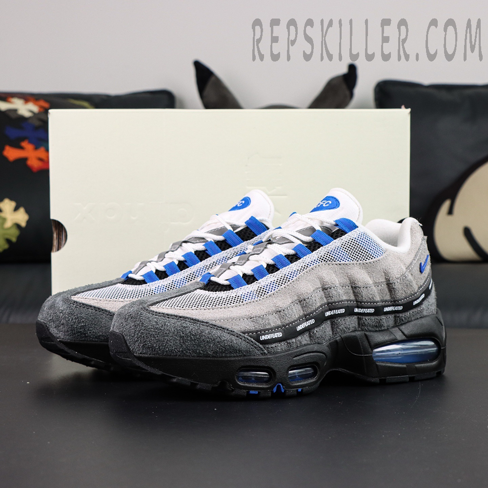 Undefeated x Nike Air Max 95 “Concord” sneakers displayed with original shoebox, side view