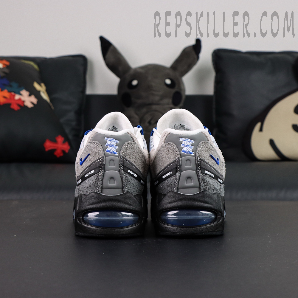 Undefeated x Nike Air Max 95 “Concord” sneakers, straight rear view showing Air Max unit and UNDEFEATED details