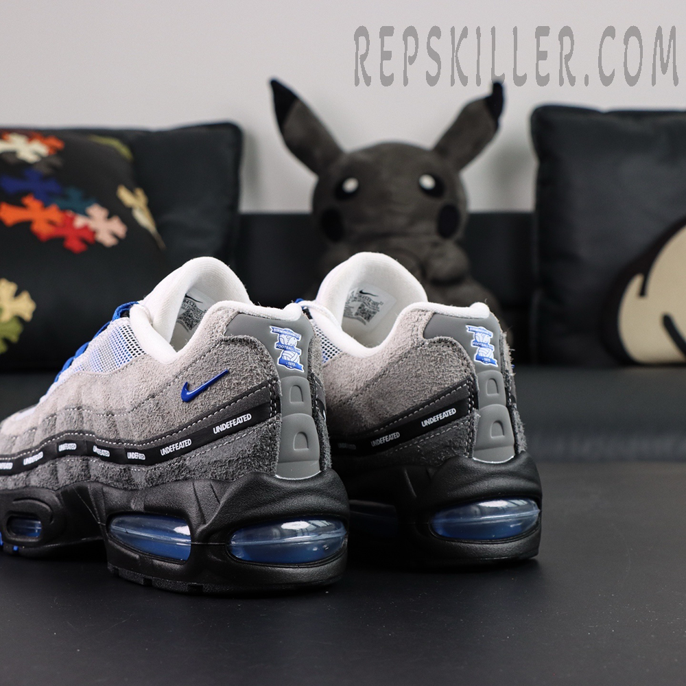 Undefeated x Nike Air Max 95 “Concord” sneakers, angled rear view with blue Air unit and layered construction