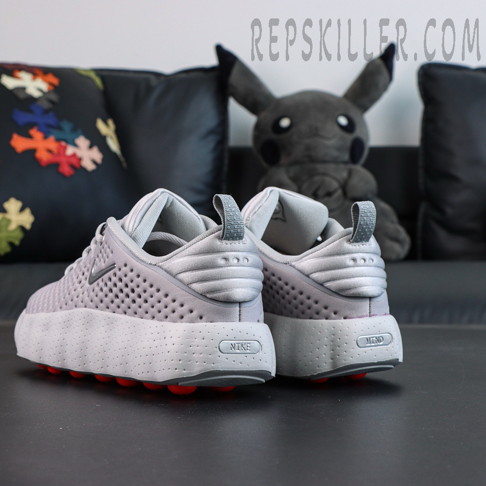 Nike Mind 002 “Light Smoke Grey” rear view with sculpted heel and branding detail