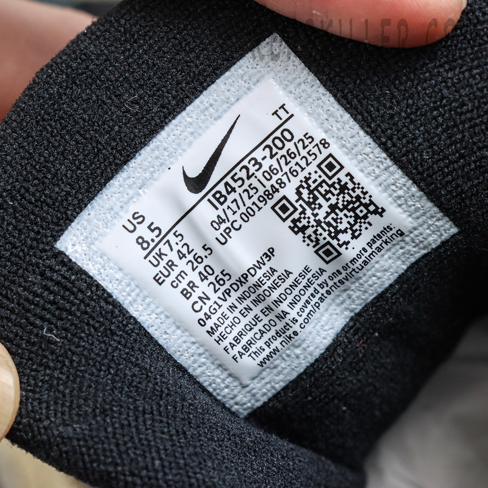 Undefeated x Nike Air Max 95 “Medium Olive” sneakers, inner tongue size tag close-up with QR code detail