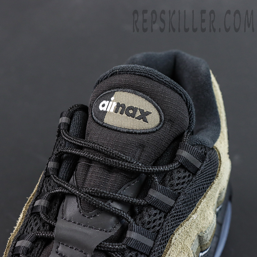 Undefeated x Nike Air Max 95 “Medium Olive” sneakers, tongue close-up with air max logo and fabric texture
