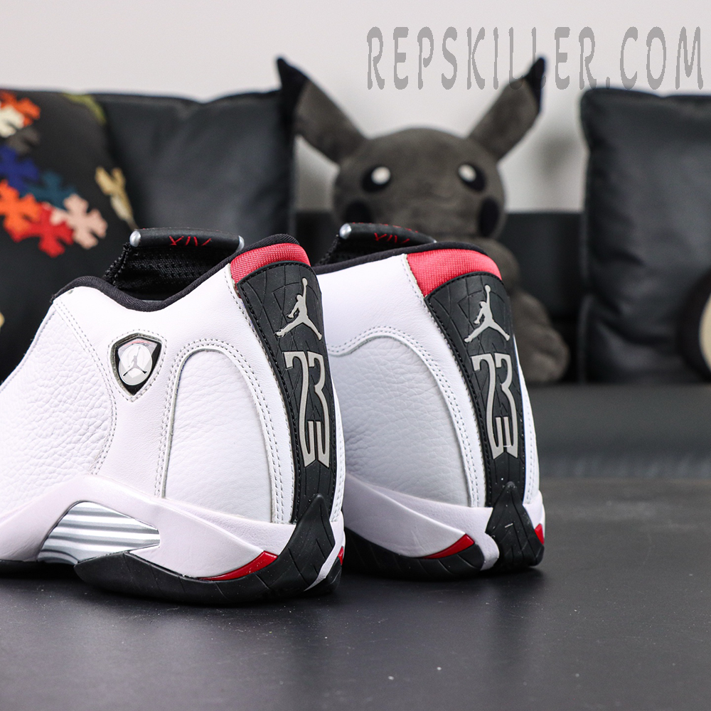 Air Jordan 14 heel close-up with shield logo and red accents