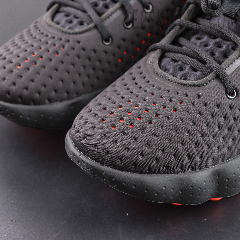 Nike Mind 002 toe box detail with dense perforation for breathability
