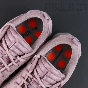 Nike Mind 002 interior view revealing orange cushioning pods on insole