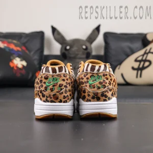 Atmos x Nike Air Max 1 DLX “Animal Pack” 2018 heel view featuring leopard print pony hair upper and green Nike Air embroidery