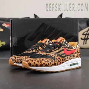 Atmos x Nike Air Max 1 DLX “Animal Pack” 2018 full pair display with mixed animal print panels and vibrant red Swoosh