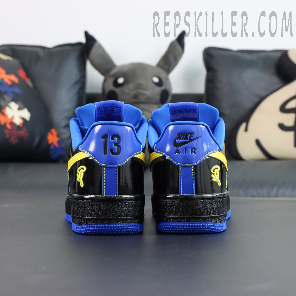 Central Cee x Nike Air Force 1 Low “Black Optic Yellow” Friends & Family heel view with “13” and Nike Air branding