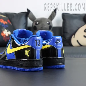 Central Cee x Nike Air Force 1 Low “Black Optic Yellow” Friends & Family rear angled detail with embroidered logo and blue outsole